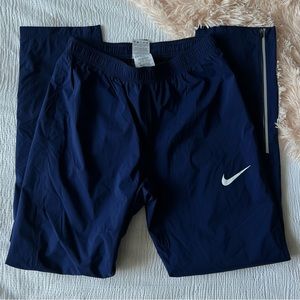 navy blue nike track pants/windbreaker pants